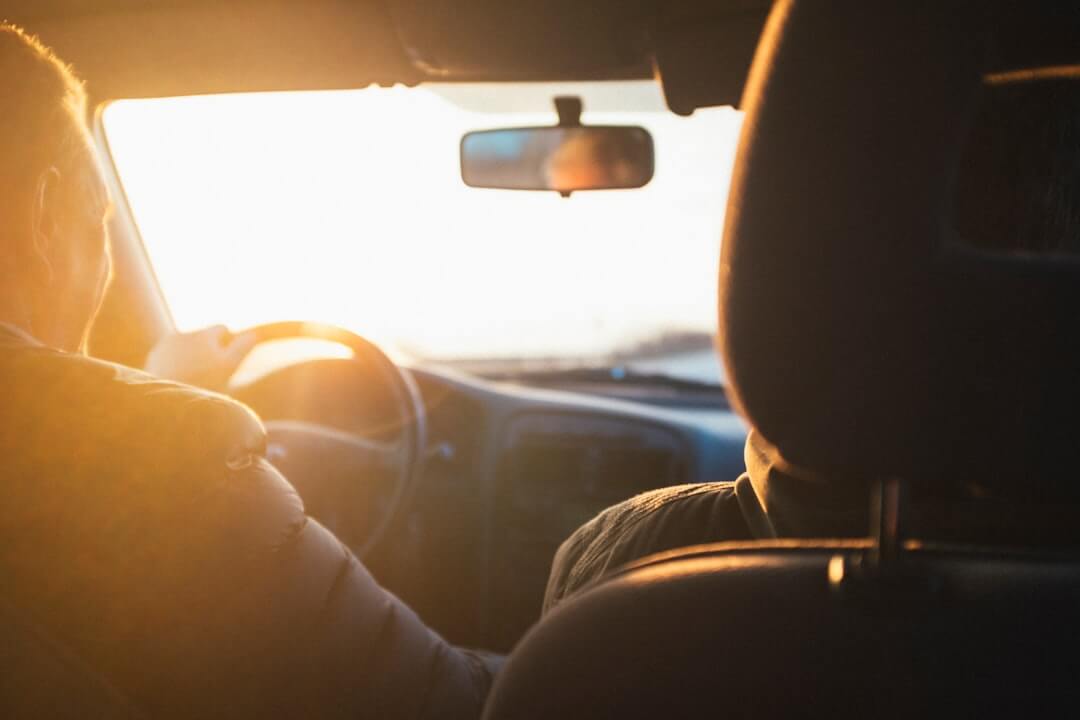 Image of people driving a car
